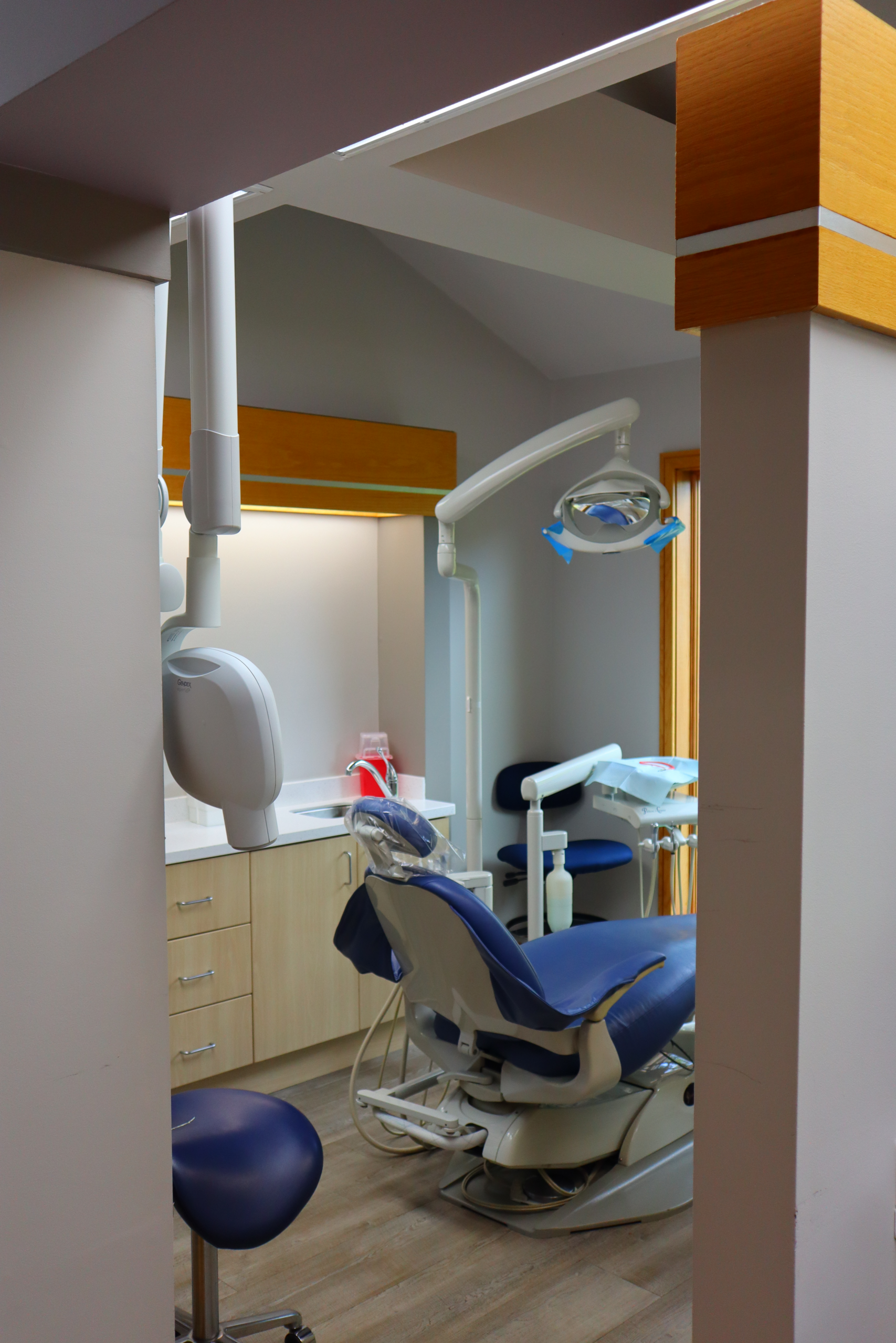 Comfortable examination chair in a bright treatment room at Sandu Family Dentistry