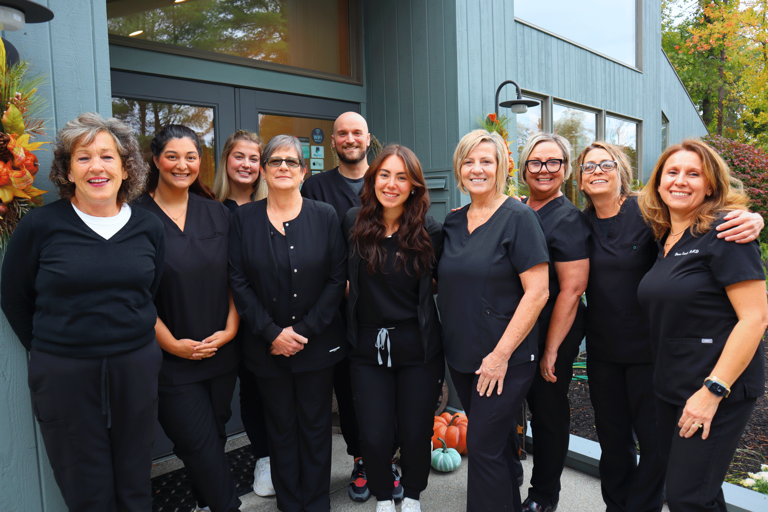 The full Sandu Family Dentistry team gathered outside the office